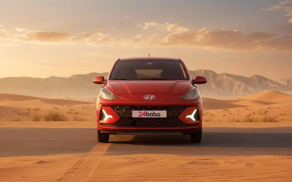 Hyundai GrandI10 2023 Red front view with headlights – rental in Dubai