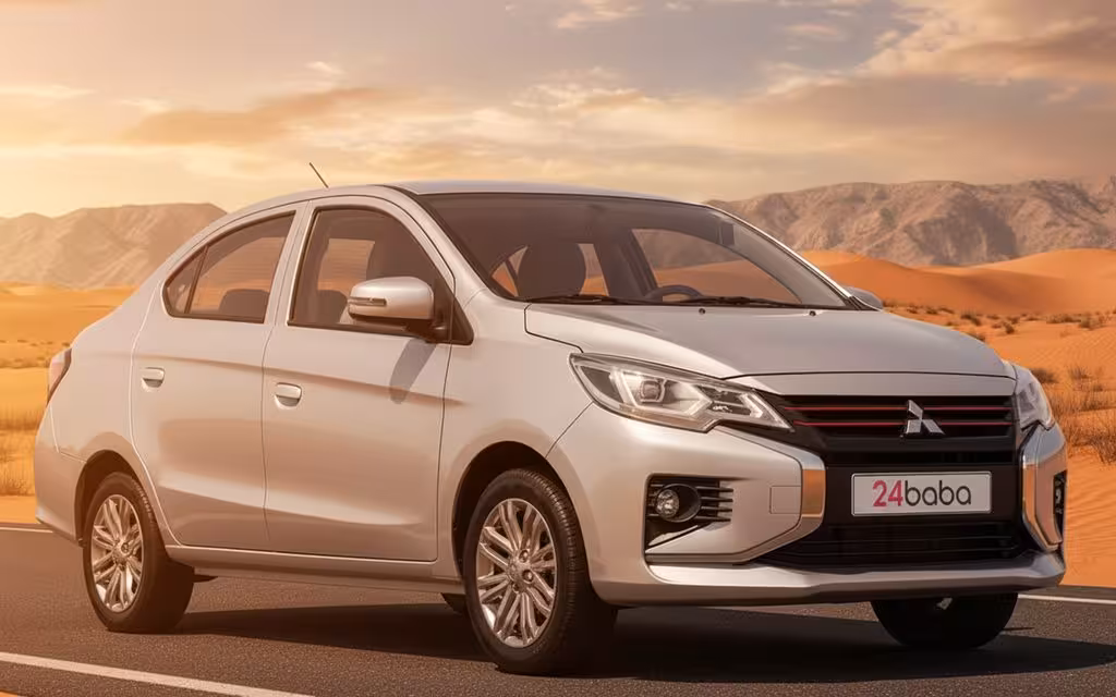 Mitsubishi Attrage 2025 Silver front view with headlights – rental in Dubai