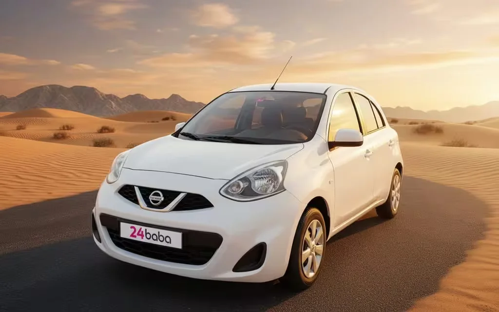 Nissan Micra 2020 White front view with headlights – rental in Dubai