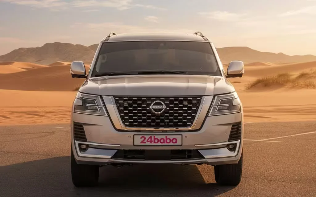 Nissan Patrol 2023 Silver front view with headlights – rental in Dubai