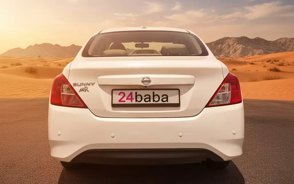 Nissan Sunny 2024 White rear view showing taillights – rental in Dubai