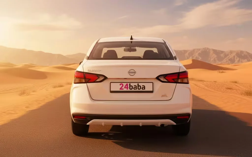 Nissan Sunny 2024 White rear view showing taillights – rental in Dubai