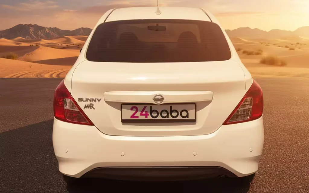 Nissan Sunny 2024 White rear view showing taillights – rental in Dubai